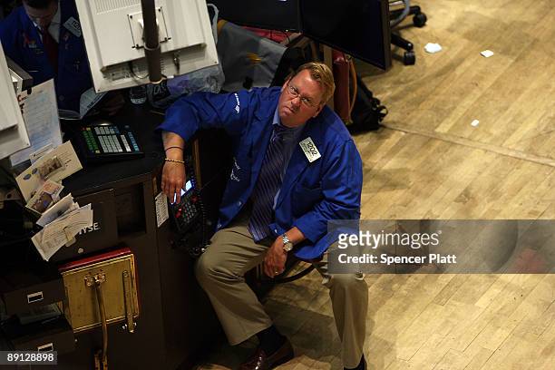 Trader pauses on the floor of the New York Stock Exchange during morning trading on July 21, 2009 in New York City. Federal Reserve Chairman Ben...