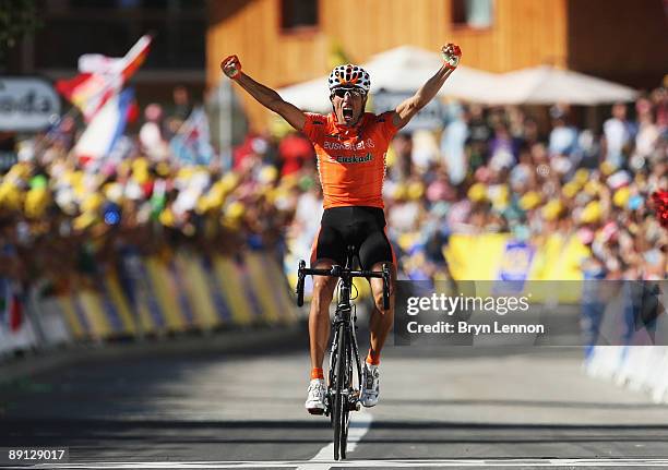 Mikel Astarloza of Spain and Euskaltel-Euskadi celebrates as he crosses the finish line to win stage 16 of the 2009 Tour de France from Martigny to...