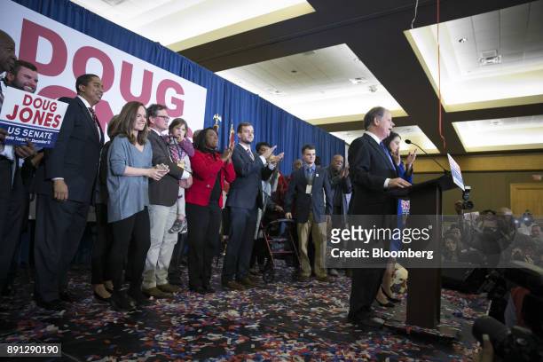 Senator-elect Doug Jones, a Democrat from Alabama, right, addresses the audience at an election night party in Birmingham, Alabama, U.S., on Tuesday,...