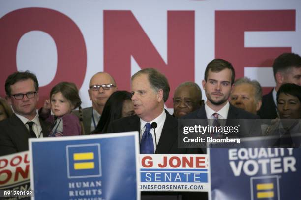 Senator-elect Doug Jones, a Democrat from Alabama, center, addresses the audience at an election night party in Birmingham, Alabama, U.S., on...