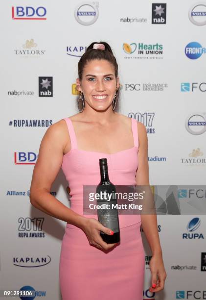 Charlotte Caslick poses after winning the People's Choice Australian Player of the Year award during the RUPA Awards Lunch at The Ivy on December 13,...