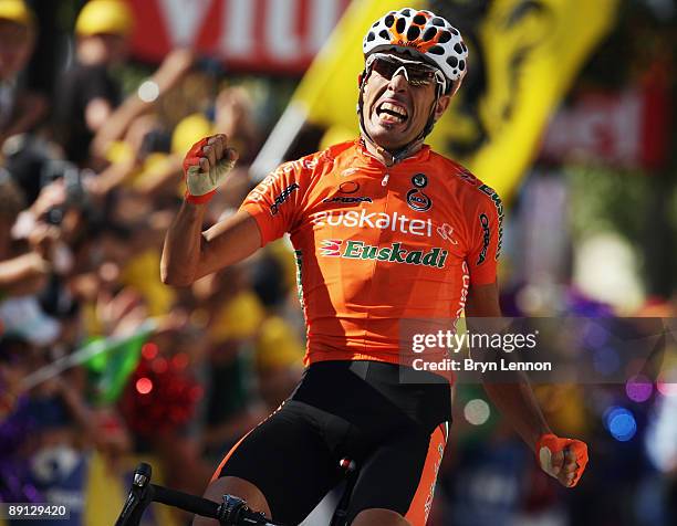 Mikel Astarloza of Spain and Euskaltel-Euskadi celebrates as he crosses the finish line to win stage 16 of the 2009 Tour de France from Martigny to...