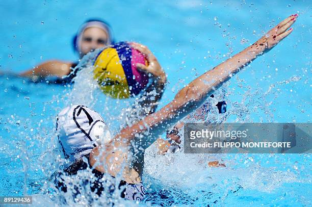 Ashley Smallfield of New Zealand fights for the ball with Katrina Monton during the Women's water-polo preliminary round Group B match New Zealand...