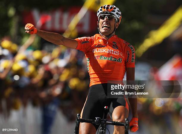 Mikel Astarloza of Spain and Euskaltel-Euskadi celebrates as he crosses the finish line to win stage 16 of the 2009 Tour de France from Martigny to...
