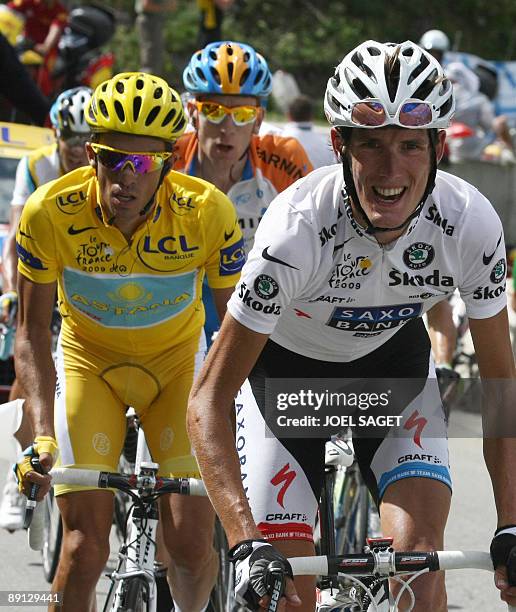 Yellow jersey of overall leader, 2007 Tour de France winner and Kazakh cycling team Astana 's leader Alberto Contador of Spain rides with Danish...