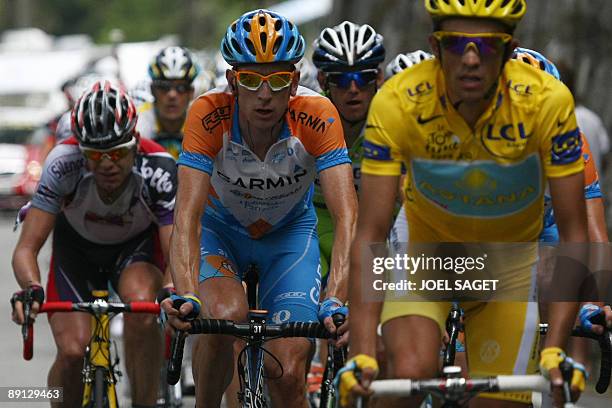 Yellow jersey of overall leader, 2007 Tour de France winner and Kazakh cycling team Astana 's leader Alberto Contador of Spain rides US cycling team...