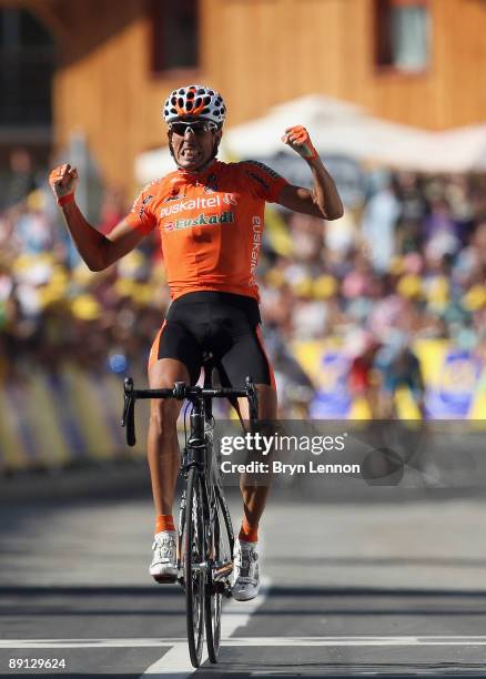 Mikel Astarloza of Spain and Euskaltel-Euskadi celebrates as he crosses the finish line to win stage 16 of the 2009 Tour de France from Martigny to...