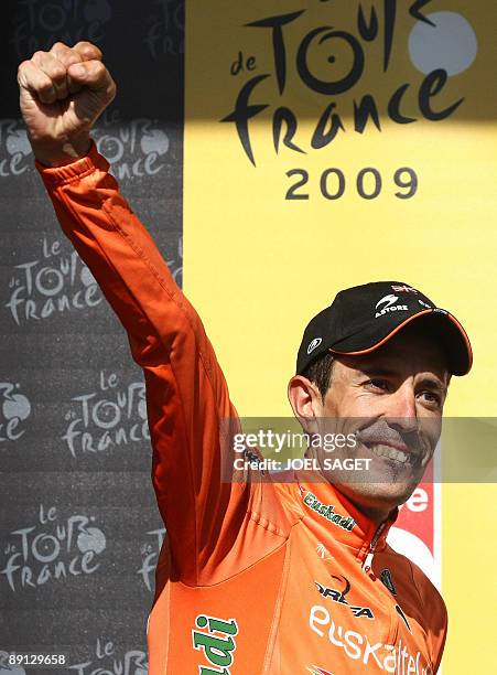 Spanish cycling team Euskatel-Euskadi 's Mikel Astarloza of Spain jubilates on the podium after winning on July 21, 2009 the 159 km and sixteenth...