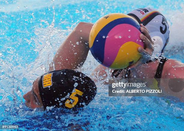 Brazilian Marina Zablith fights for the ball with German captain Katrin Dierolf during the Women's water-polo preliminary round Group D match Germany...