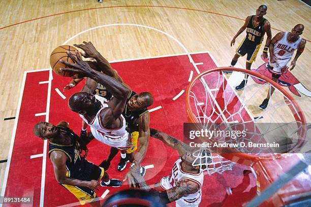 Michael Jordan of the Chicago Bulls takes the ball to the basket against the Indiana Pacers in Game Five of the Eastern Conference Finals during the...