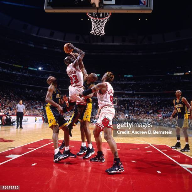 Michael Jordan of the Chicago Bulls goes up for a shot against the Indiana Pacers in Game Five of the Eastern Conference Finals during the 1998 NBA...
