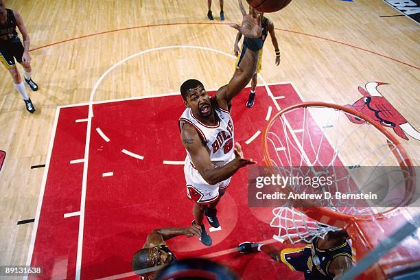 Dickey Simpkins of the Chicago Bulls shoots a layup against the Indiana Pacers in Game Five of the Eastern Conference Finals during the 1998 NBA...