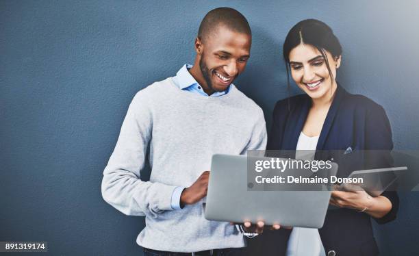 deciding on ideas together - woman blue background stock pictures, royalty-free photos & images