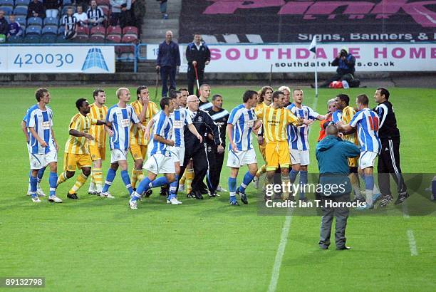 Players confront each other after the half time whistle during a pre-season friendly match between Huddersfield Town and Newcastle United at the...