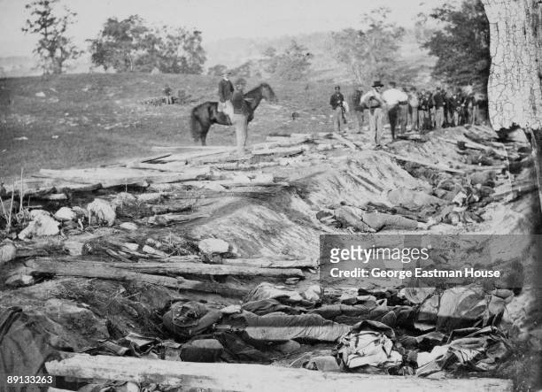 View of a ditch which had been used as a rifle-pit at the Battle of Antietam , 1862. The bodies of dead soldiers can be seen in the ditch.