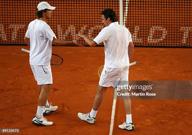 Mischa Zverev of Germany and Michael Stich of Germany in action during the match against Simon Aspelin of Sweden and Paul Hanley of Australia during...