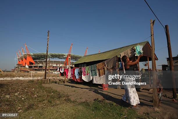 Local residents home is dwarfed by the Mbombela Stadium which will be one of the stadia used for the 2010 FIFA World Cup on July 21, 2009 in...