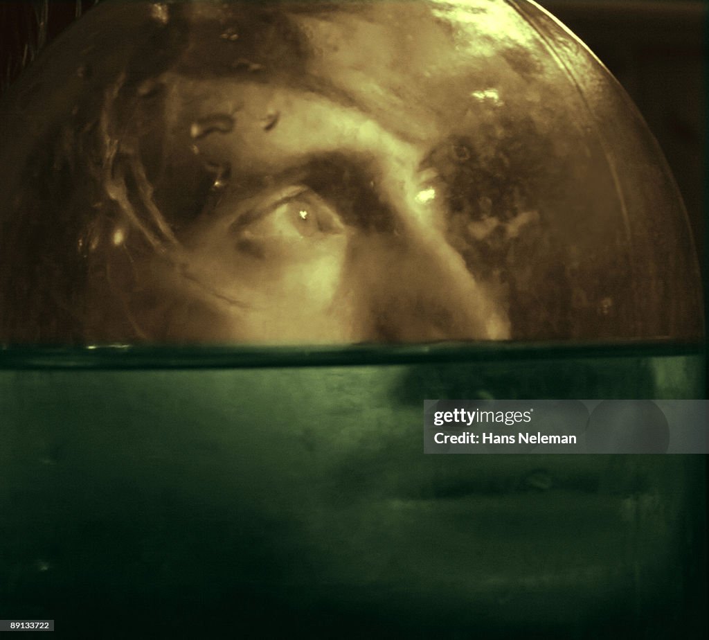 Face of a man behind an aquarium, Odessa, Ukraine