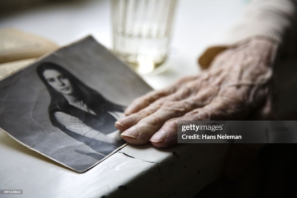 Close-up of a senior woman's hand with a photograph, Moscow, Russia