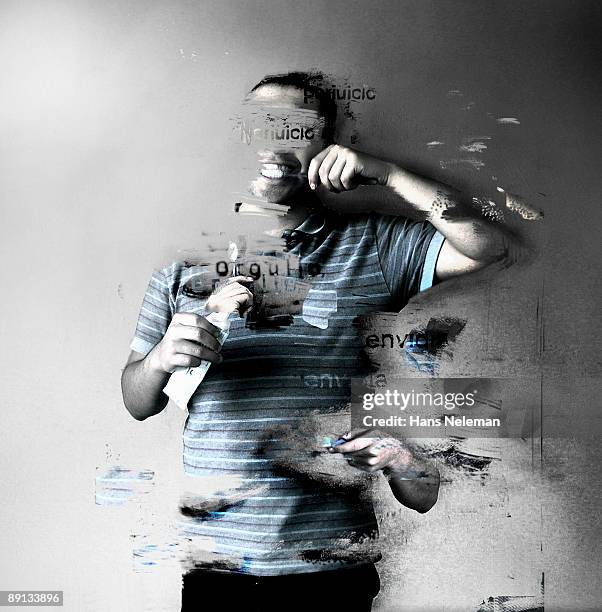 young man brushing his teeth and erasing himself - eraser stock pictures, royalty-free photos & images