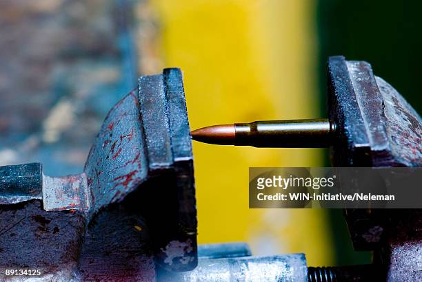 close-up of a bullet caught in a vise grip, sevastopol, crimea, ukraine - weapon stock pictures, royalty-free photos & images