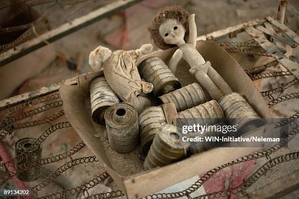 close-up of respirator filters with a toy, prypiat, ukraine  - table bomb stock pictures, royalty-free photos & images