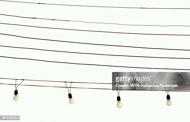light bulbs hanging from cables, santiago, chile  - koord stockfoto's en -beelden