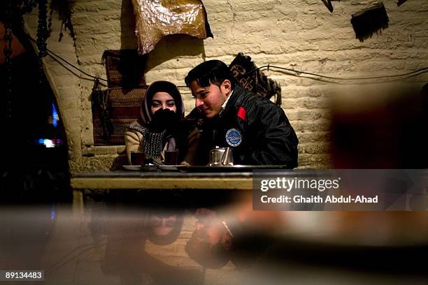 Iranian sit in a tea house under the 16th century Si-o-Seh Pol on December 29, 2007 in Isfahan, Iran.