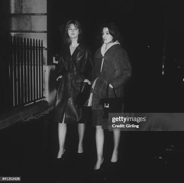 British showgirls Christine Keeler and Mandy Rice-Davies walking together, London, UK, 17th January 1963. Both were known for their roles in the...