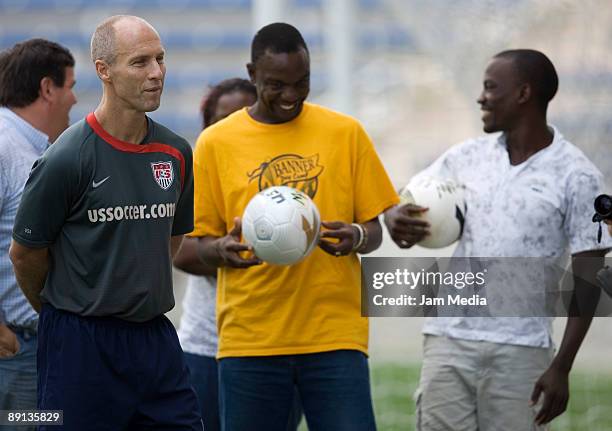 Head coach Bob Bradley and two visitors from Uganda during a training session at The Toyota Park, on July 21, 2009 in Chicago, Illinois.