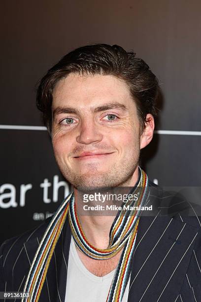 Tom Burke attends Bryan Adams 'Hear The World Ambassadors' exhibition at Saatchi Gallery on July 21, 2009 in London, England.