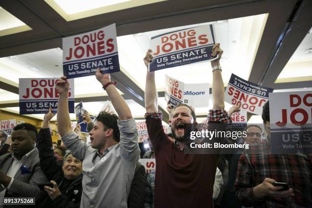 Attendees celebrate during an election night party for Senator-elect Doug Jones, a Democrat from Alabama, in Birmingham, Alabama, U.S., on Tuesday,...