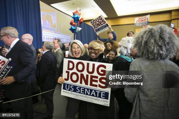 Attendees celebrate during an election night party for Senator-elect Doug Jones, a Democrat from Alabama, in Birmingham, Alabama, U.S., on Tuesday,...