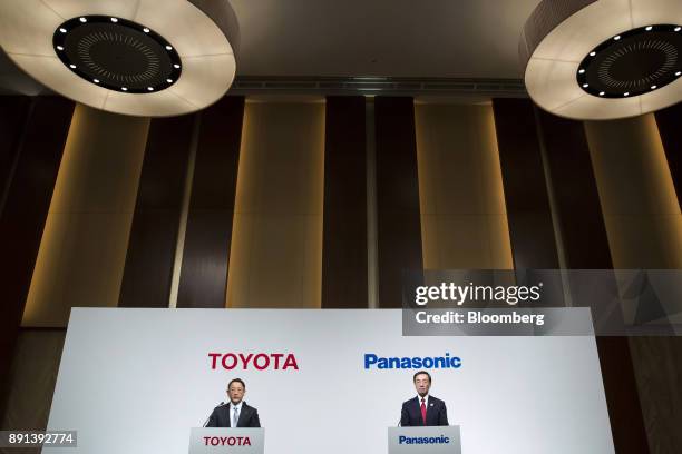 Akio Toyoda, president of Toyota Motor Corp., left, and Kazuhiro Tsuga, president of Panasonic Corp., attend a joint news conference in Tokyo, Japan,...