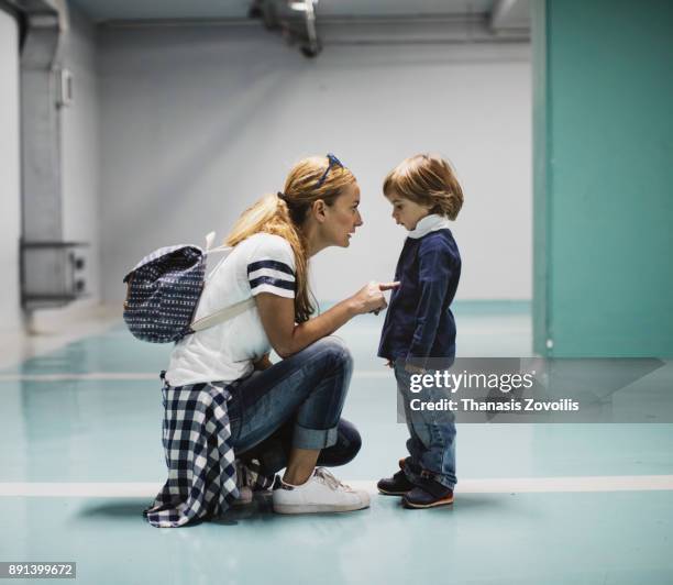 mother berating her son - animal behavior stock-fotos und bilder