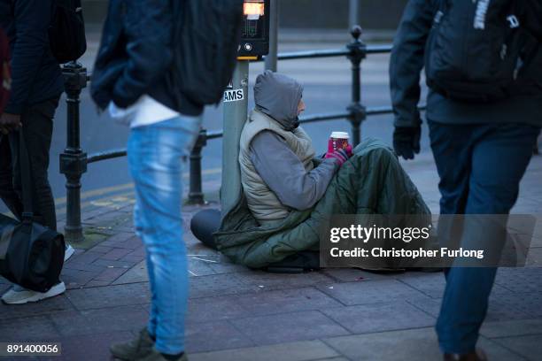 Homeless man begs for small change on the streets of Manchester on December 11, 2017 in Manchester, England. Many homeless people are spending the...