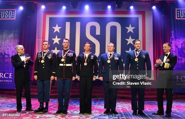 36th Chief of Staff Gen. George W. Casey, Jr., Captain Joshua Pitcher, Sergeant Miles Hogan, Navy Aircrewman Helicopter Second Class Daniel Harlow,...