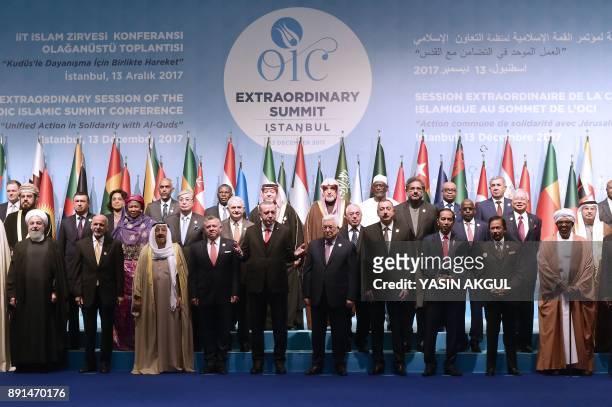 Leaders and representatives of member states pose for a group photo during an Extraordinary Summit of the Organisation of Islamic Cooperation on last...