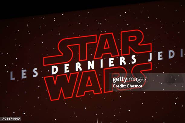 Logo of 'Star Wars: The Last Jedi' is seen on a sceen prior to the public screening at the Grand Rex cinema on December 13, 2017 in Paris, France.