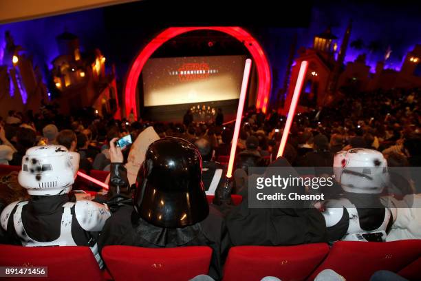 People dressed in character costumes from Star Wars series pose prior to the public screening of 'Star Wars: The Last Jedi' at the Grand Rex cinema...