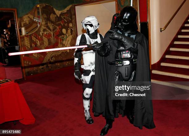 People dressed in character costumes from Star Wars series, stormtrooper and Darth Vader pose prior to the public screening of 'Star Wars: The Last...