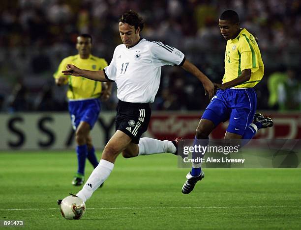 Marco Bode of Germany is chased by Kleberson of Brazil during the Germany v Brazil, World Cup Final match played at the International Stadium...