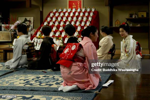 Maiko and geiko geisha girls bow in gratitude with each other during an annual gratitude event for the past year and best wishes for the new year on...