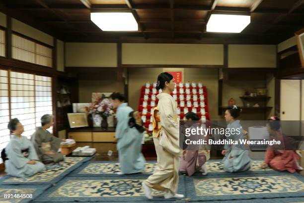 Maiko geisha girl returns after giving gratitude to her traditional dance master Inoue Yachiyo during an annual gratitude event for the past year and...