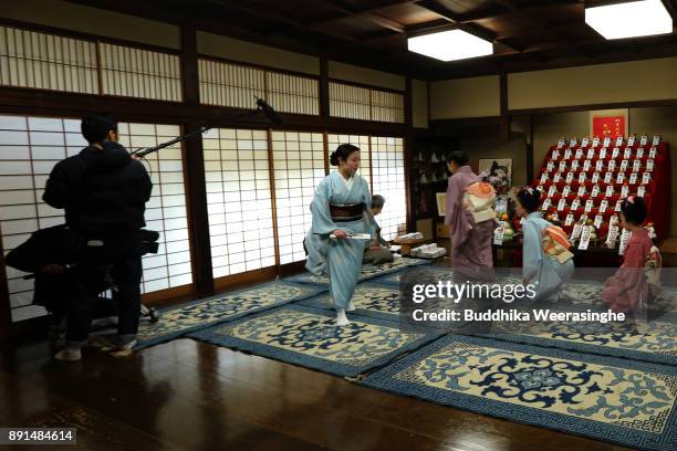 Geiko geisha girl returns after giving gratitude to her traditional dance master Inoue Yachiyo during an annual gratitude event for the past year and...