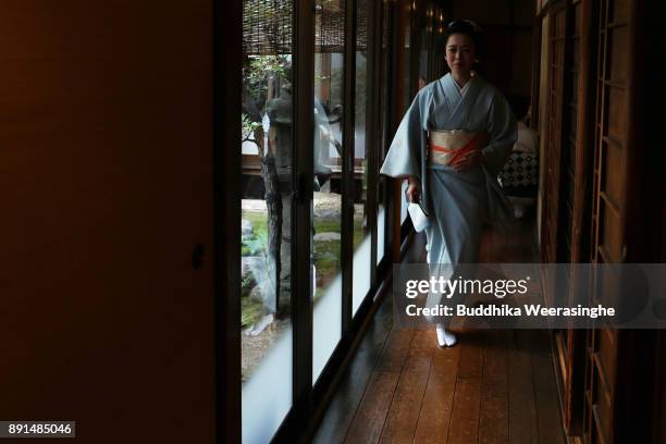 Maiko geisha girl arrives to give gratitude to her traditional dance master during an annual gratitude event for the past year and best wishes for...