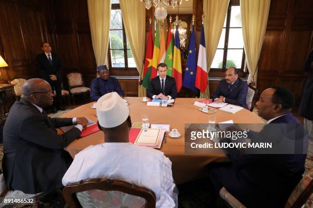 French President Emmanuel Macron hosts a meeting with Burkina Faso's President Roch Marc Christian Kabore, Chadian President Idriss Deby, Malian...