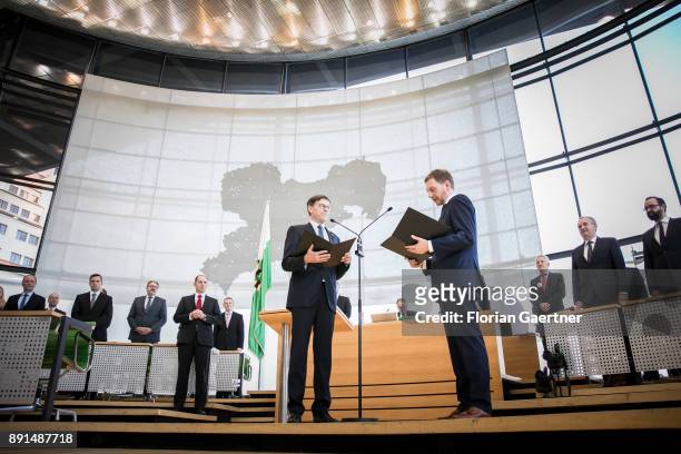 Matthias Roessler , president of the Landtag of Saxony, and Michael Kretschmer, new prime minister of the German State of Saxony, are pictured during...