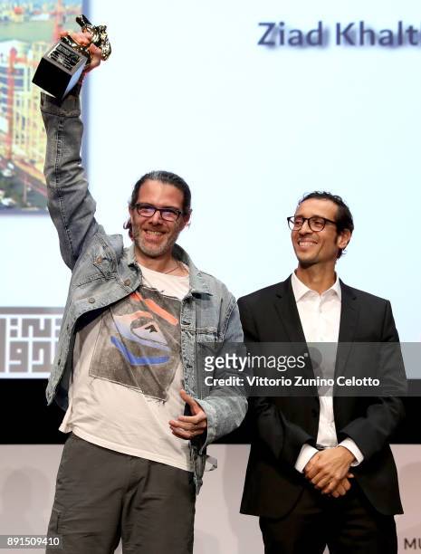 Director Ziad Khalthoum celebrates with the Muhr Best Non Fiction Feature award for "Taste of Cement" at the Muhr Awards on day eight of the 14th...