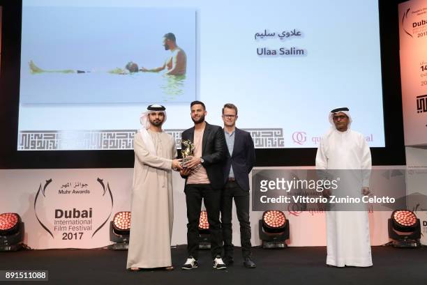 Director Ulaa Salim with the Muhr Gulf Short Best Film award for "Land of Our Fathers" with HH Sheikh Mansoor bin Mohammed bin Rashid Al Maktoum and...
